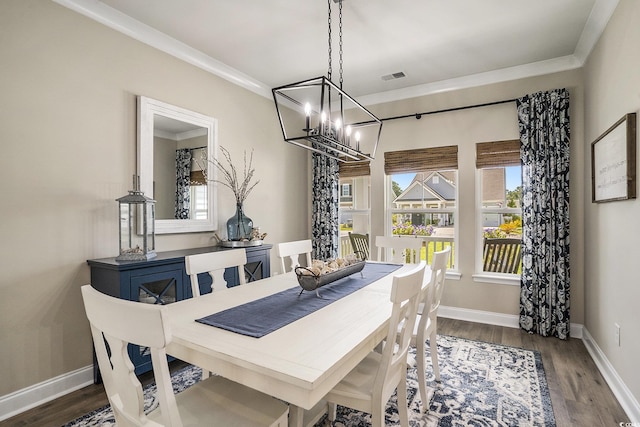 860 Brant St, Myrtle Beach, SC 29579 - dining room with a chandelier, wood finished floors, and crown molding