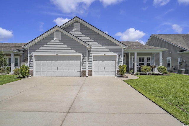 860 Brant St, Myrtle Beach, SC 29579 - single story home with a porch, an attached garage, a front yard, and concrete driveway
