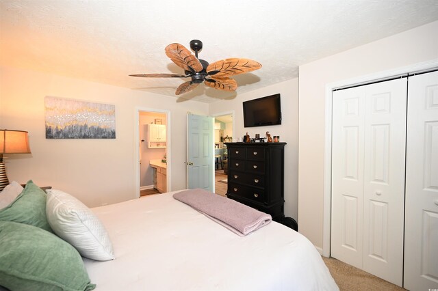 697 Tupelo Ln Unit 24G, Longs, SC 29568 - bedroom featuring a closet, connected bathroom, light colored carpet, and ceiling fan