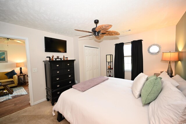 697 Tupelo Ln Unit 24G, Longs, SC 29568 - bedroom with light colored carpet, a closet, and ceiling fan