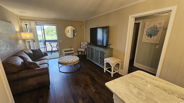 405 21st Ave S Unit 2J, North Myrtle Beach, SC 29582 - living area featuring dark wood-type flooring, ornamental molding, a textured ceiling, and heating unit