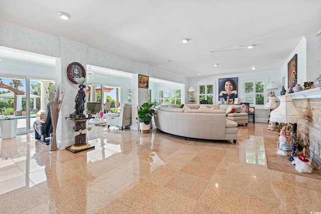 5000 N Ocean Blvd, Myrtle Beach, SC 29577 - living area featuring plenty of natural light, granite tiled floors, crown molding, and a fireplace