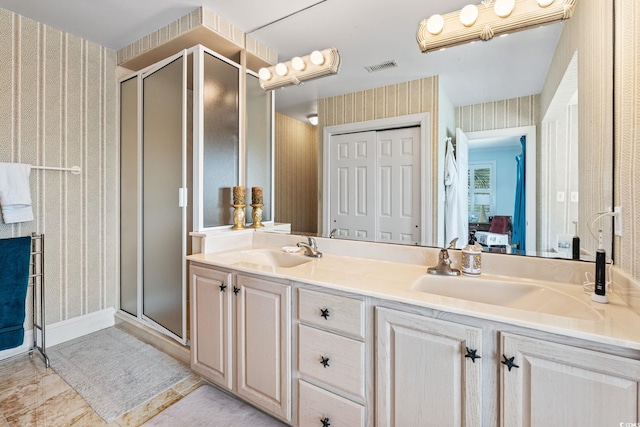 5000 N Ocean Blvd, Myrtle Beach, SC 29577 - full bathroom with wallpapered walls, a shower stall, double vanity, and ensuite bath