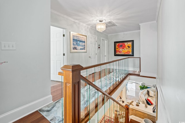 5000 N Ocean Blvd, Myrtle Beach, SC 29577 - stairs with wood finished floors, crown molding, and attic access
