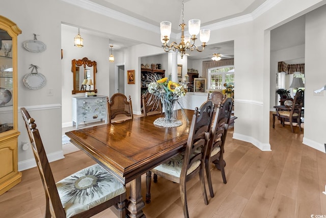 4507 Smilax Pl, Murrells Inlet, SC 29576 - dining room with a chandelier, light wood-style floors, crown molding, and ceiling fan