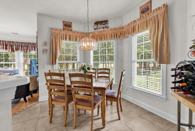 4507 Smilax Pl, Murrells Inlet, SC 29576 - dining area with a chandelier, light tile patterned floors, and healthy amount of natural light