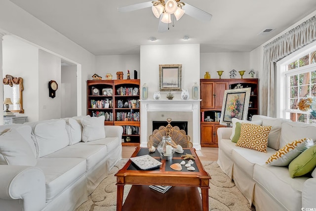 4507 Smilax Pl, Murrells Inlet, SC 29576 - living area with ceiling fan, a fireplace, and light wood-type flooring