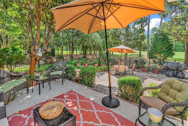 4507 Smilax Pl, Murrells Inlet, SC 29576 - fenced backyard with a patio, area for grilling, and outdoor lounge area