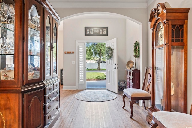 4002 Bayfield Loop, Murrells Inlet, SC 29576 - foyer with arched walkways, light wood-style flooring, and ornamental molding
