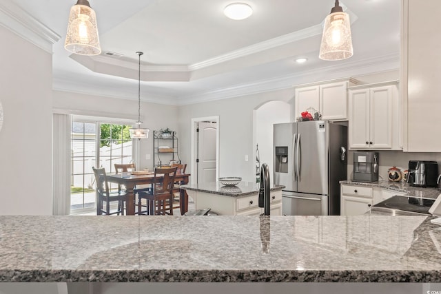 4002 Bayfield Loop, Murrells Inlet, SC 29576 - kitchen with stainless steel fridge, crown molding, dark stone counters, arched walkways, and white cabinets