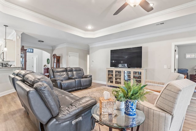 4002 Bayfield Loop, Murrells Inlet, SC 29576 - living area featuring light wood-style flooring, ceiling fan, arched walkways, ornate columns, and crown molding