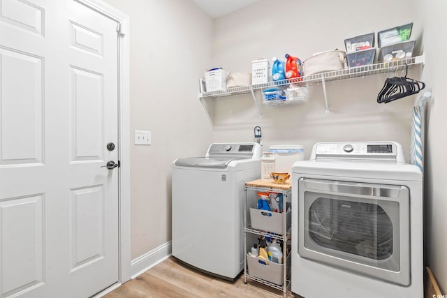 4002 Bayfield Loop, Murrells Inlet, SC 29576 - laundry room featuring washing machine and dryer and light wood-style floors