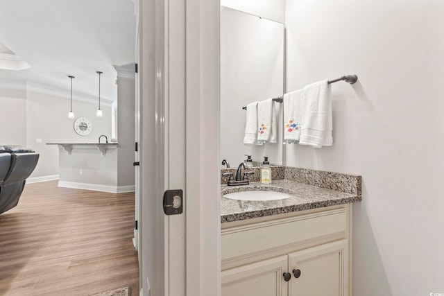 4002 Bayfield Loop, Murrells Inlet, SC 29576 - bathroom with ornamental molding, wood finished floors, and vanity