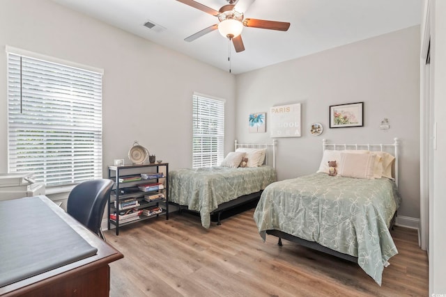 4002 Bayfield Loop, Murrells Inlet, SC 29576 - bedroom featuring wood finished floors, ceiling fan, and a desk