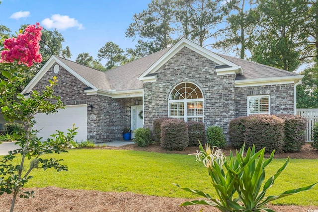 4002 Bayfield Loop, Murrells Inlet, SC 29576 - traditional home featuring an attached garage, a front yard, roof with shingles, and brick siding