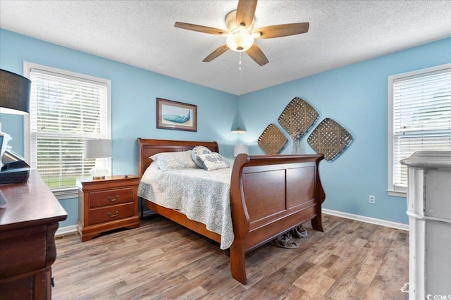 322 Azalea Ave, Marion, SC 29571 - bedroom featuring light wood finished floors, a textured ceiling, and ceiling fan
