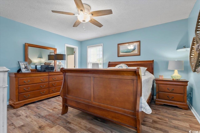 322 Azalea Ave, Marion, SC 29571 - bedroom with wood finished floors, a textured ceiling, and a ceiling fan