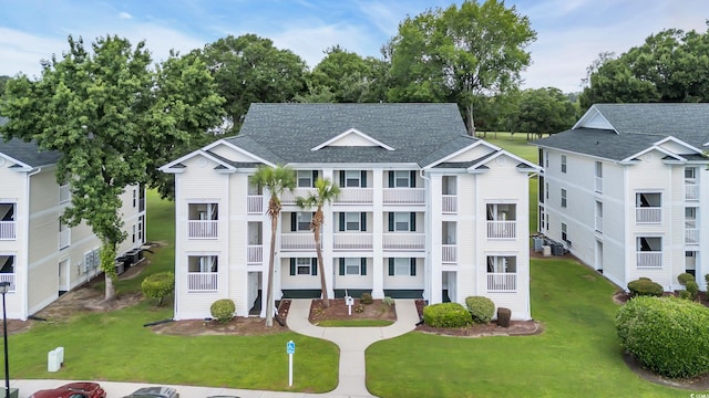 521 White River Dr Unit 21C, Myrtle Beach, SC 29579 - view of front of property with a front lawn and roof with shingles