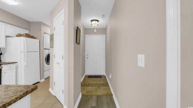 521 White River Dr Unit 21C, Myrtle Beach, SC 29579 - washroom featuring washer / clothes dryer and light tile patterned floors