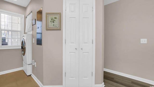 521 White River Dr Unit 21C, Myrtle Beach, SC 29579 - hallway featuring baseboards and stacked washing machine and dryer