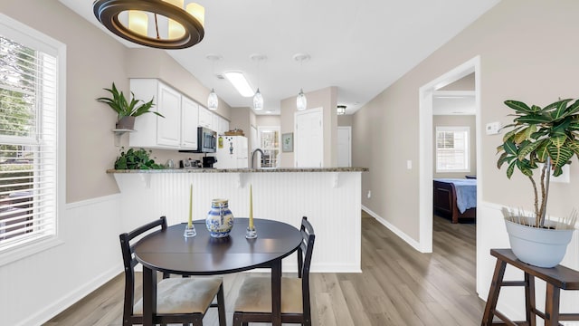 521 White River Dr Unit 21C, Myrtle Beach, SC 29579 - dining room featuring light wood finished floors and healthy amount of natural light