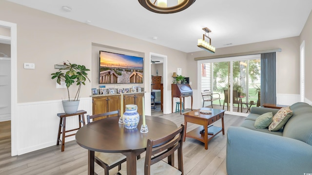 521 White River Dr Unit 21C, Myrtle Beach, SC 29579 - living room with a wainscoted wall and light wood-style flooring