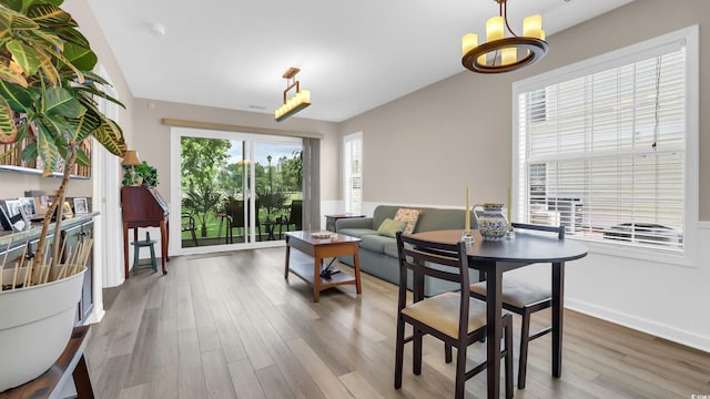 521 White River Dr Unit 21C, Myrtle Beach, SC 29579 - dining room with wood finished floors and a chandelier
