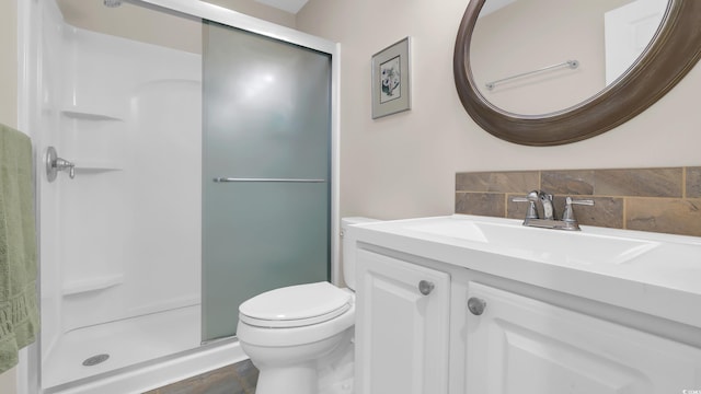 521 White River Dr Unit 21C, Myrtle Beach, SC 29579 - full bathroom featuring a shower stall, vanity, and decorative backsplash