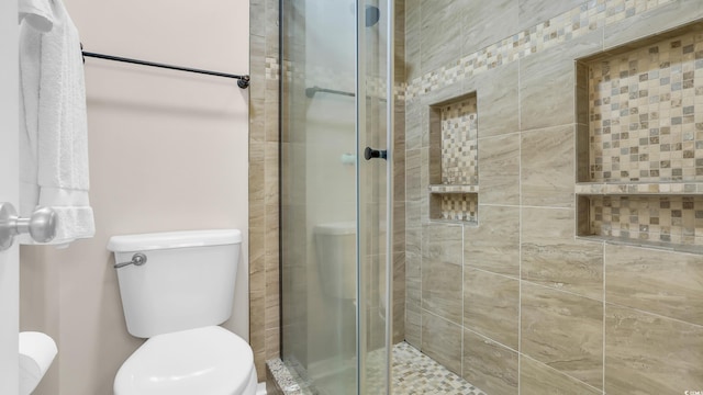 521 White River Dr Unit 21C, Myrtle Beach, SC 29579 - bathroom featuring toilet and a stall shower