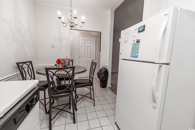 9755 Leyland Dr Unit 11, Myrtle Beach, SC 29572 - dining space featuring a chandelier, ornamental molding, and light tile patterned floors