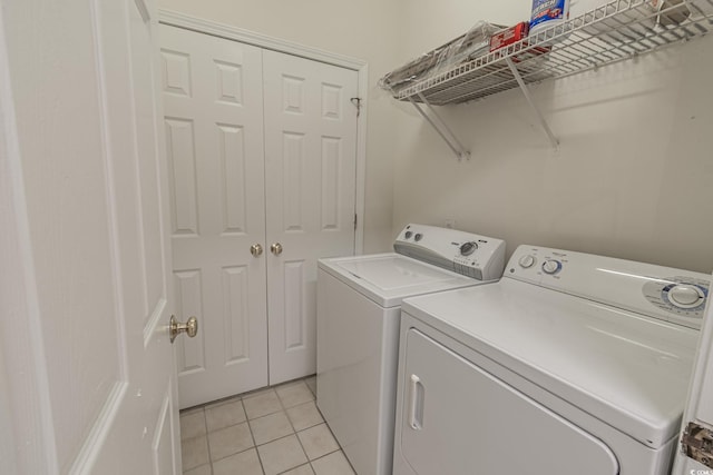 9755 Leyland Dr Unit 11, Myrtle Beach, SC 29572 - laundry room with washing machine and clothes dryer and light tile patterned flooring