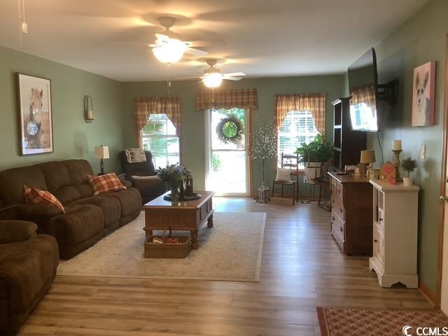 390 Boundary Ave, Murrells Inlet, SC 29576 - living area featuring wood finished floors and a ceiling fan
