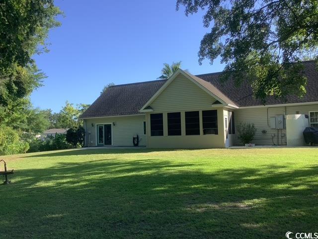 390 Boundary Ave, Murrells Inlet, SC 29576 - rear view of house featuring a yard