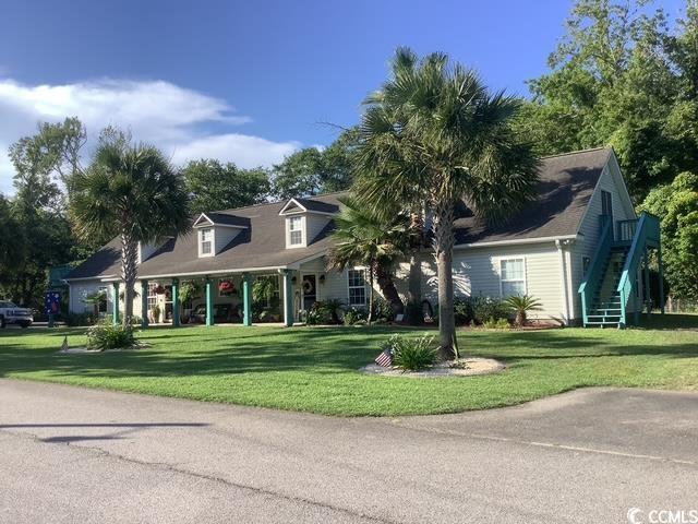 390 Boundary Ave, Murrells Inlet, SC 29576 - cape cod-style house with stairway and a front yard