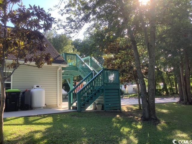 390 Boundary Ave, Murrells Inlet, SC 29576 - rear view of property with stairs and a lawn