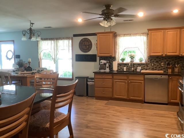 390 Boundary Ave, Murrells Inlet, SC 29576 - kitchen with dishwasher, backsplash, dark countertops, ceiling fan, and recessed lighting