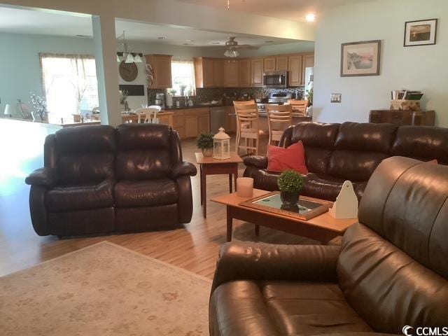390 Boundary Ave, Murrells Inlet, SC 29576 - living room with light wood finished floors and a ceiling fan