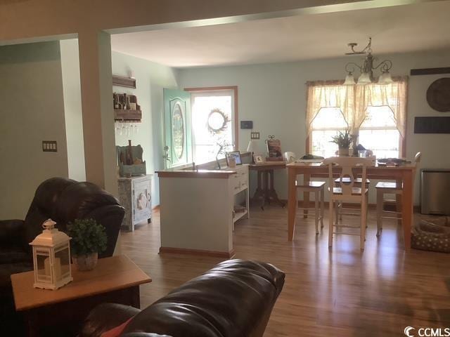 390 Boundary Ave, Murrells Inlet, SC 29576 - living area with healthy amount of natural light, wood finished floors, and a chandelier