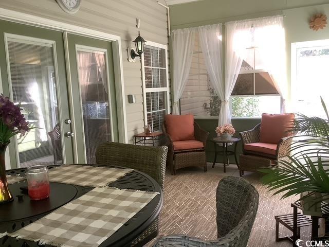 390 Boundary Ave, Murrells Inlet, SC 29576 - sunroom featuring healthy amount of natural light and carpet