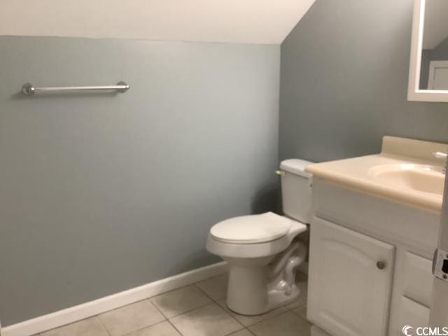 390 Boundary Ave, Murrells Inlet, SC 29576 - half bathroom with vanity, tile patterned floors, and lofted ceiling
