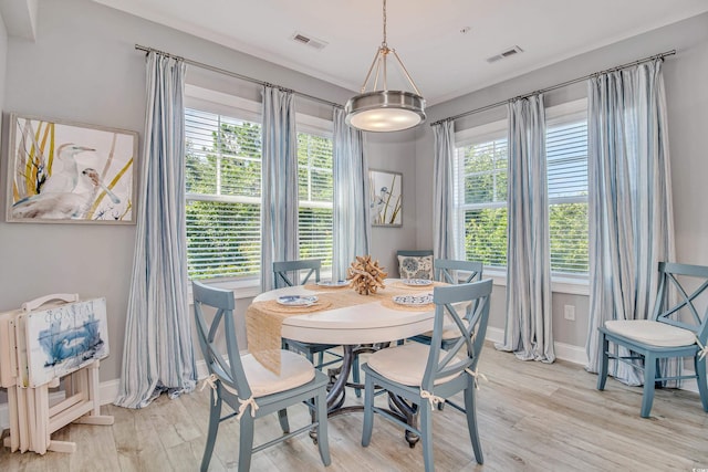 6203 Catalina Dr Unit 935, North Myrtle Beach, SC 29582 - dining room featuring plenty of natural light and light wood-type flooring