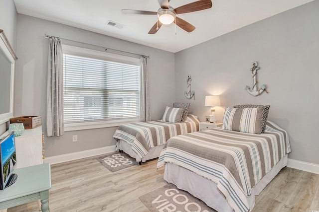 6203 Catalina Dr Unit 935, North Myrtle Beach, SC 29582 - bedroom featuring wood finished floors and ceiling fan