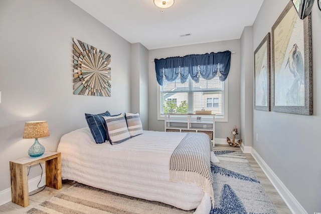 6203 Catalina Dr Unit 935, North Myrtle Beach, SC 29582 - bedroom with wood finished floors and baseboards