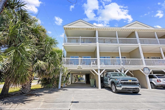 1020 Ocean Blvd S Unit A, Surfside Beach, SC 29575 - view of front of house featuring a carport and driveway