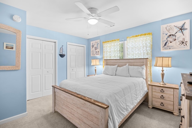1020 Ocean Blvd S Unit A, Surfside Beach, SC 29575 - bedroom with light carpet, multiple closets, and a ceiling fan