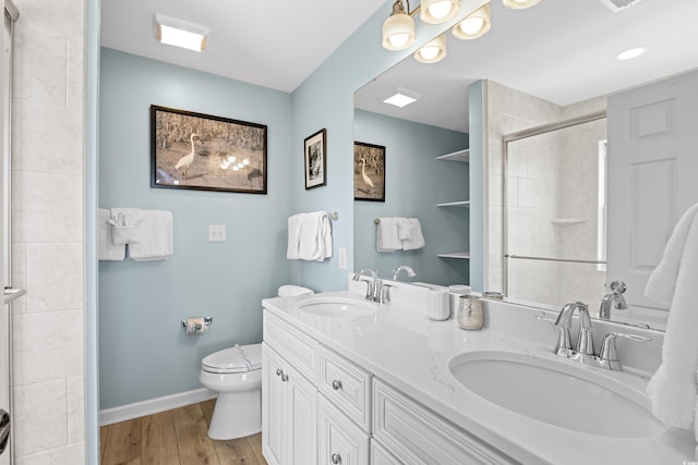 1020 Ocean Blvd S Unit A, Surfside Beach, SC 29575 - full bath with double vanity, a tile shower, and wood finished floors