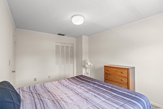 4115 Little River Rd Unit 10E, Myrtle Beach, SC 29579 - bedroom with a textured ceiling, a closet, and crown molding