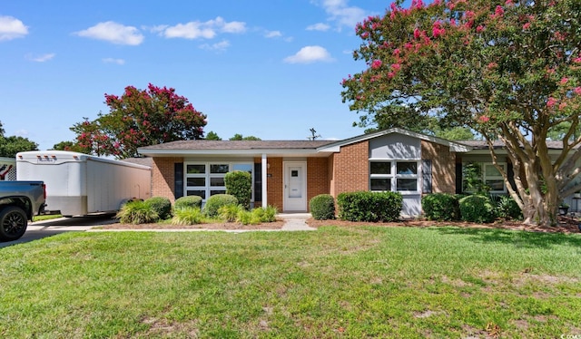 3748 Otter St Unit 3748, Myrtle Beach, SC 29577 - ranch-style house featuring brick siding and a front lawn