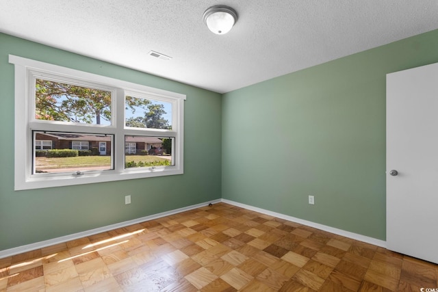 3748 Otter St Unit 3748, Myrtle Beach, SC 29577 - spare room with a textured ceiling and baseboards