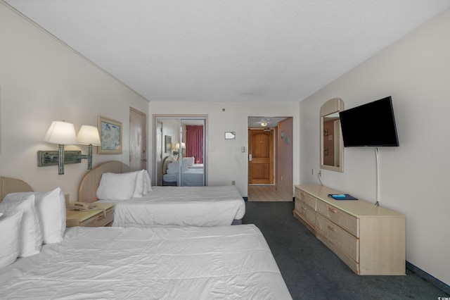 9550 Shore Dr Unit 1537/1538, Myrtle Beach, SC 29572 - bedroom with dark colored carpet and a closet